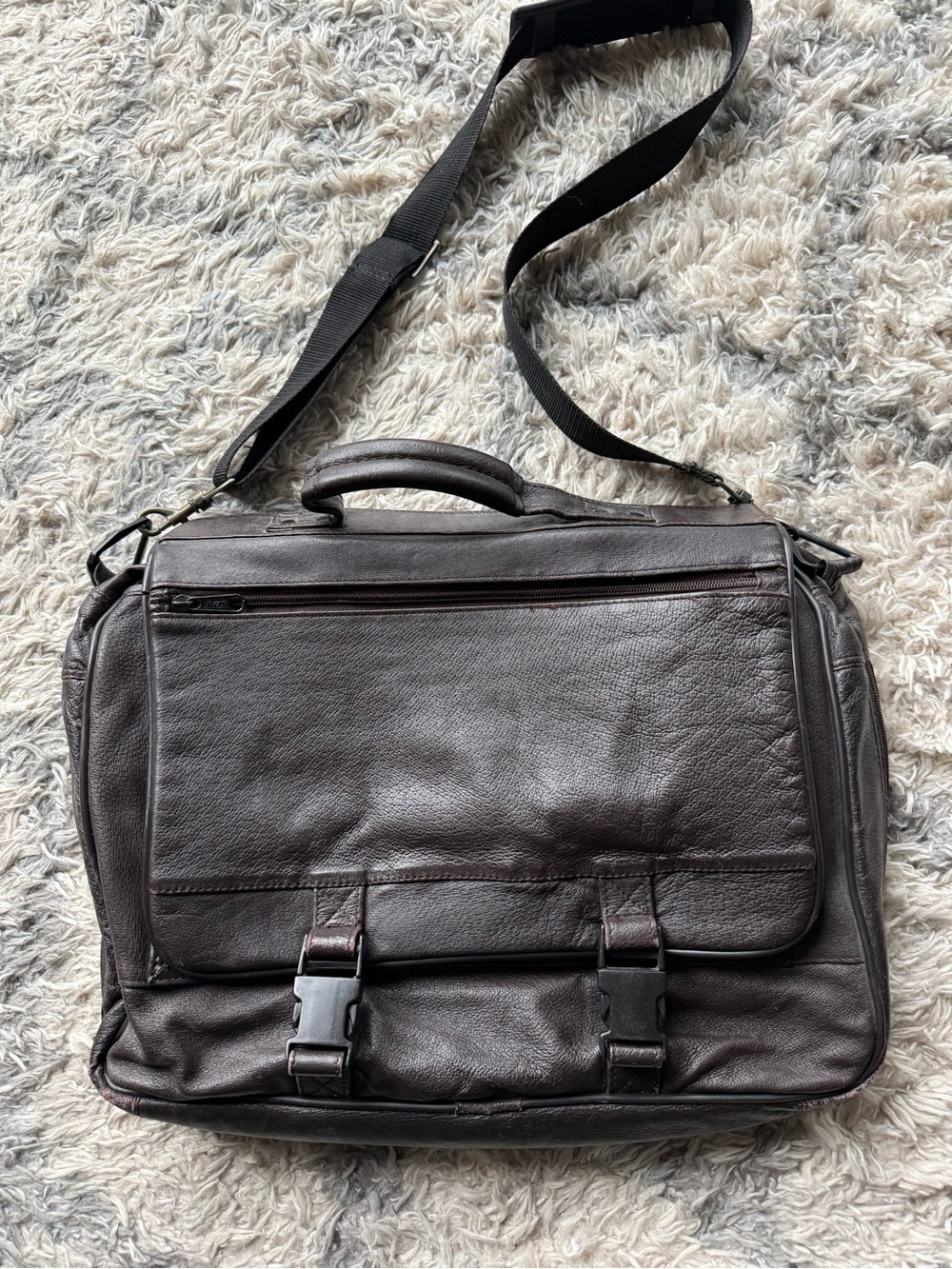 Leather Messenger Bag with padded, adjustable strap.  Gender neutral.